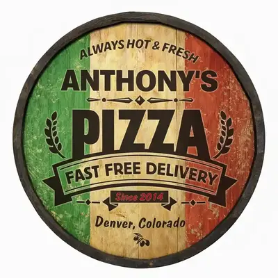 Close up of handmade barrel end pizza sign showing wood texture and bold PIZZA lettering