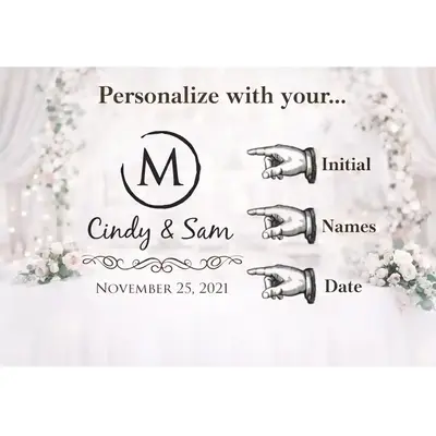 Wedding guest writing a message in a guest book beside a personalized wedding card barrel used for collecting wedding cards and envelopes.