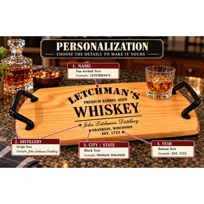 Personalized whiskey barrel head serving tray showing custom engraving options for name, distillery, city, state, and year with black wrought iron handles.