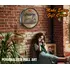 Woman sitting with scotch whiskey quarter barrel sign behind her