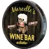 Handmade quarter barrel wine bar sign with Marcelle’s Wine Bar & Bistro design on wood barrel end side view