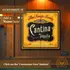 Custom Cantina Tequila dartboard cabinet mounted on wood-paneled wall with “Customize It – Add a Name Here” text overlay and personalized family name displayed on the doors.