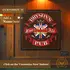Custom name English pub dartboard cabinet mounted on wood-paneled wall, displaying “Bryson’s Fine Ale Pub” design with Union Jack crest and banner details, shown with “Customize It” callout.