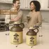 Half-gallon and one-liter alien-abduction moonshine jugs displayed on a kitchen counter with size measurements, while a couple enjoys drinks in the background.