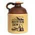 Vintage-style ceramic Mountain Dew moonshine jug with brown top, cork stopper, and black mountain-and-still graphic on the front.