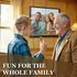 Family enjoying a personalized custom photo dartboard cabinet set mounted in a game room, preparing to play darts together.