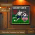 Personalized soccer dartboard cabinet with custom name mounted on wood game room wall