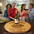 Couples enjoying wine around a personalized barrel head lazy susan centerpiece on a coffee table.