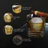 Close-up of whiskey glass with cigar rest showing thick base, heavy glass wall and round ice ball mold.