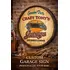 Custom Crazy Tony’s Garage quarter barrel sign mounted on brick wall in vintage mechanic workshop setting.