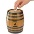 Close up of hand placing a coin into the slot of a mini oak barrel whiskey fund piggy bank
