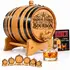 Personalized American white oak bourbon aging barrel with Phineas Farmer engraving, black steel hoops, wooden spigot, stand, whiskey glass, and Bootlegger's Bible booklet.