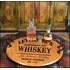Authentic oak barrel head serving tray with wrought iron handles displaying whiskey decanter and glasses on a rustic bar setup.